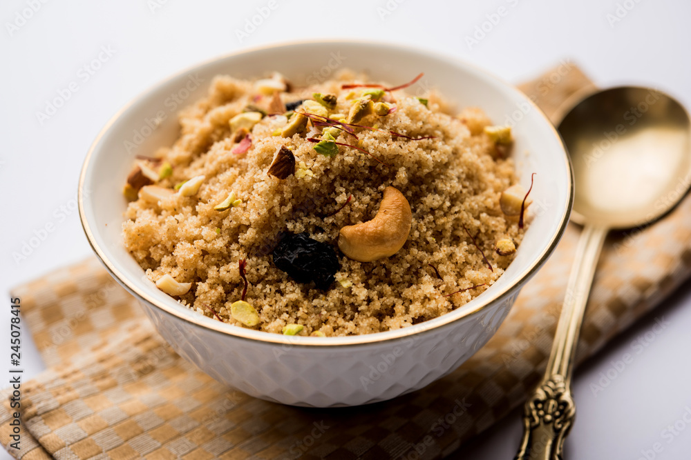 Semolina Halwa / Sooji ka Halva or sweet Rava Sheera or shira - Indian festival sweet made of semolina, nuts and Ghee Semolina Halwa / Sooji ka Halva or sweet Rava Sheera or shira - Indian festival sweet made of semolina, nuts and Ghee