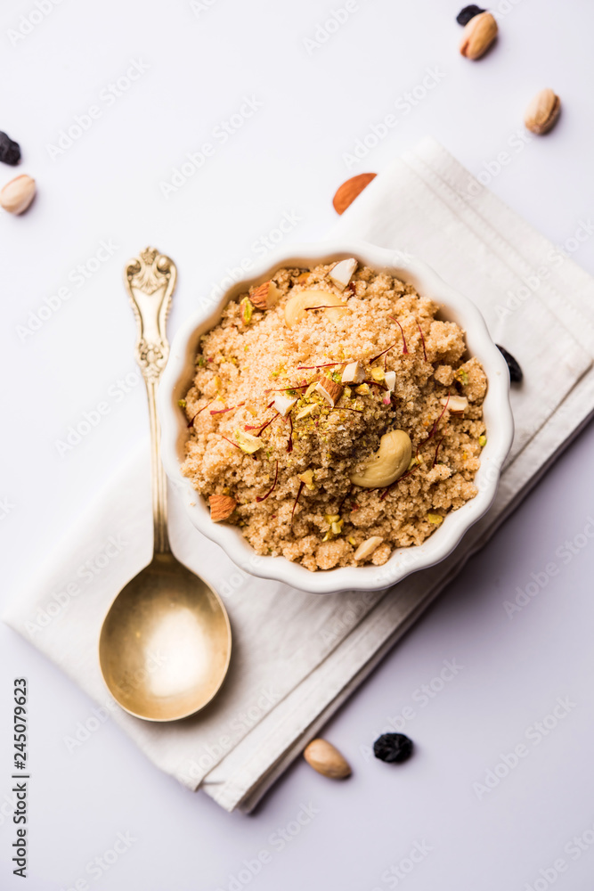 Semolina Halwa / Sooji ka Halva or sweet Rava Sheera or shira - Indian festival sweet made of semolina, nuts and Ghee Semolina Halwa / Sooji ka Halva or sweet Rava Sheera or shira - Indian festival sweet made of semolina, nuts and Ghee