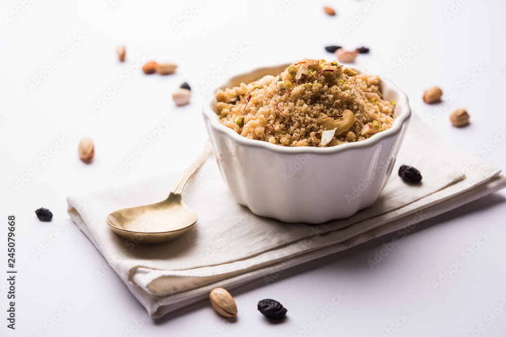 Semolina Halwa / Sooji ka Halva or sweet Rava Sheera or shira - Indian festival sweet made of semolina, nuts and Ghee Semolina Halwa / Sooji ka Halva or sweet Rava Sheera or shira - Indian festival sweet made of semolina, nuts and Ghee