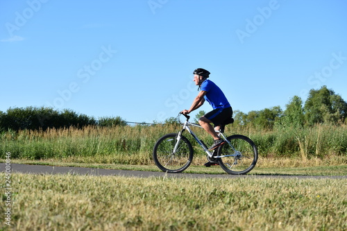 Exercising Athlete Retiree Male Cyclist Wearing Helmet Riding Bike