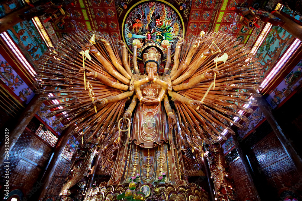 Take photo  large Guan Yin Bodhisattva carved from wood 12 meters high in Wat Metta Photiyan