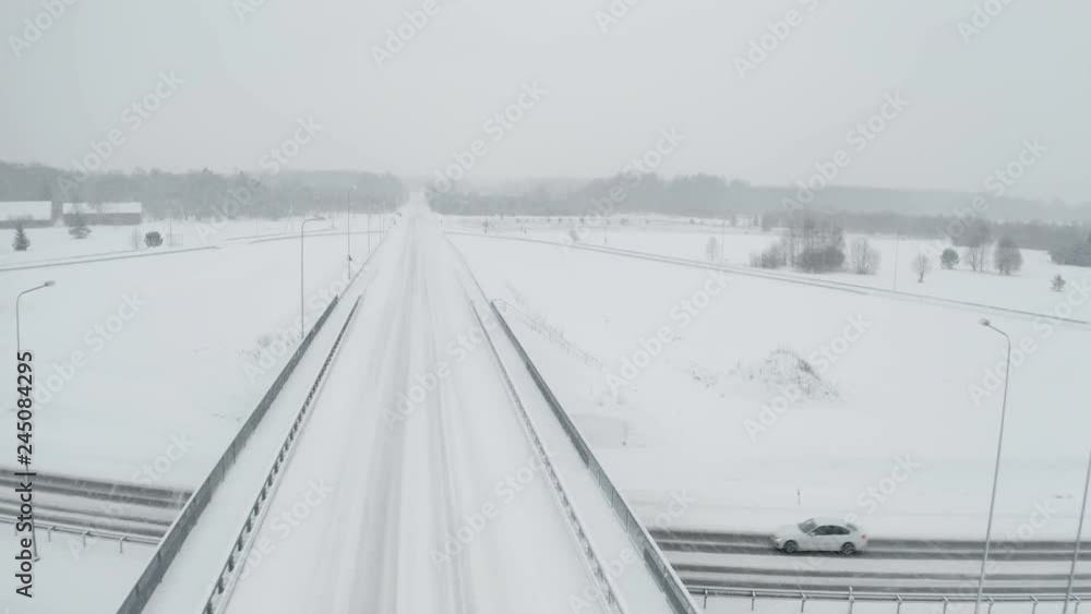 22060_Thick_white_snow_covering_the_roads_and_the_forest_on_an_aerial_drone_shot.mov 22060_Thick_white_snow_covering_the_roads_and_the_forest_on_an_aerial_drone_shot.mov