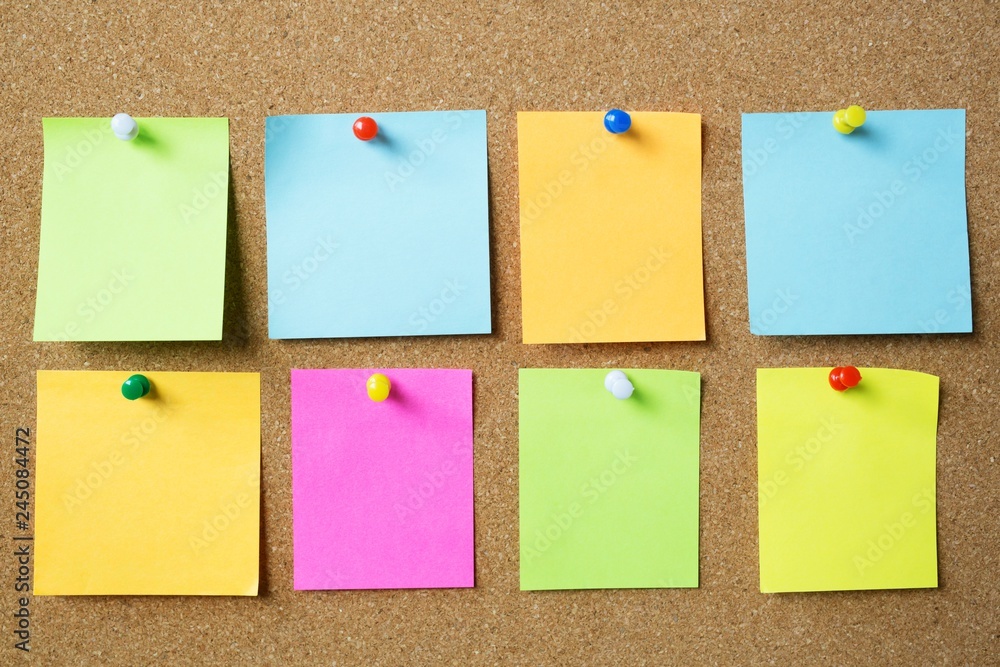 collection of colorful variety post it. paper note reminder sticky notes  pin on cork bulletin board Note reminder. empty space for text. Stock Photo