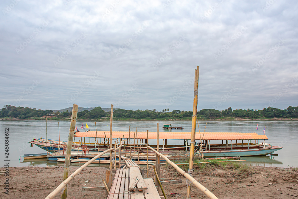 The tourist boat pier park on the Mekong River at Loei in Thailand. The tourist boat pier park on the Mekong River at Loei in Thailand.