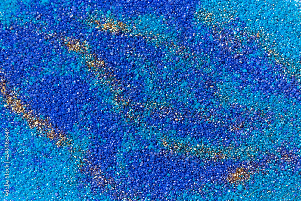 Layered colorful sand pattern. Marble style background. Blue and gold powder texture. Layered colorful sand pattern. Marble style background. Blue and gold powder texture.