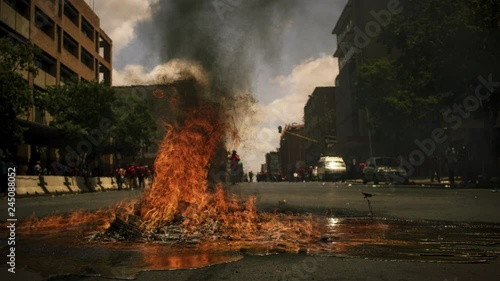 Cinemagraph of fire in street for protest riot photo