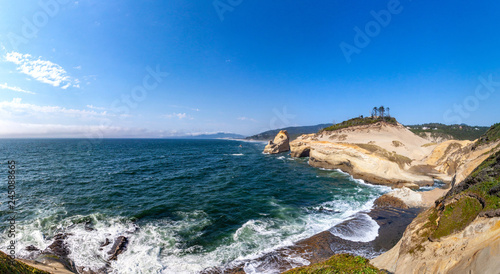 Scenic panorama on Cape Kiwanda state park, Oregon. Beautiful view overlooking cape cliff, rocks, ocean and a shoreline.