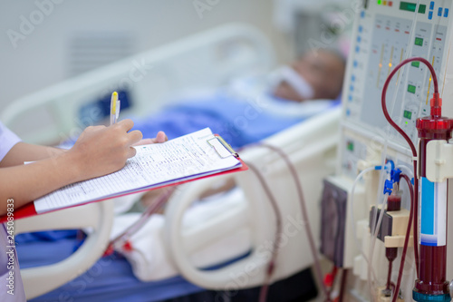Dialysis nurse are checking dialysis machine before hemodialysis replacement kidney dysfunction or renal failure in intensive care unit.