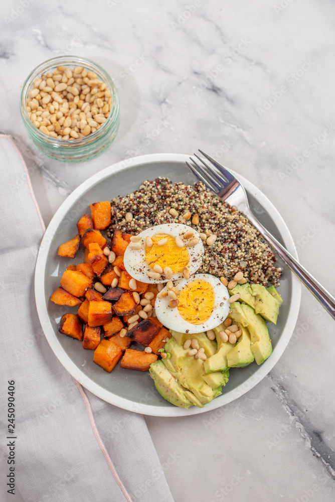 Quinoa salad in bowl with avocado Quinoa salad in bowl with avocado