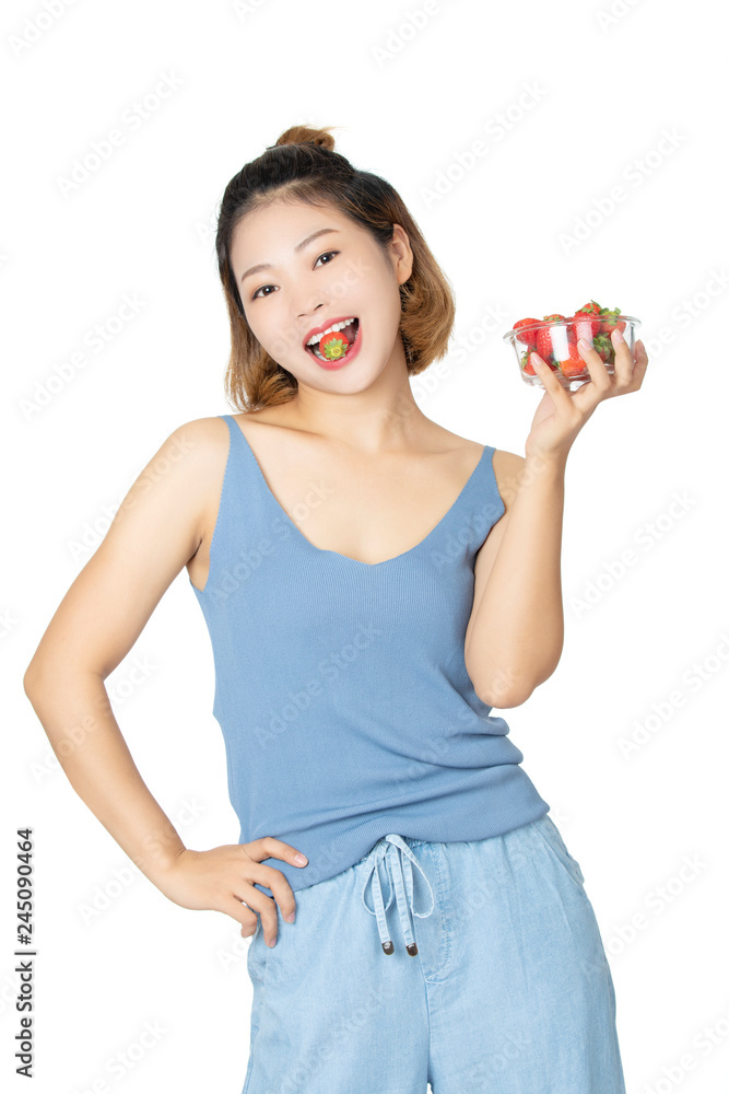 Chinese woman holding bowl of strawberries isolated on white background Chinese woman holding bowl of strawberries isolated on white background