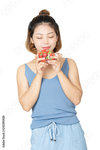 Chinese woman holding bowl of strawberries isolated on white background
