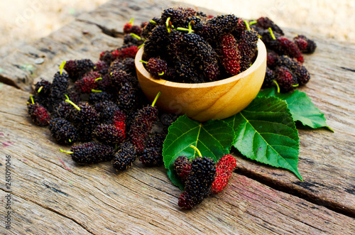 Close up of mulberry fruits on wooden table backgrounds