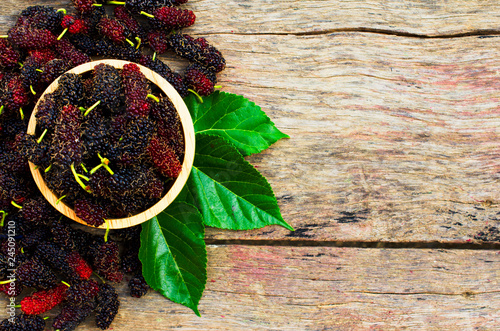 Mulberries fruits wood backgrounds above with space for text