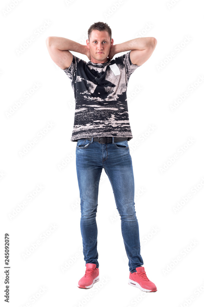 Athletic handsome man posing with hands behind head with intense look at camera. Full body isolated on white background. Athletic handsome man posing with hands behind head with intense look at camera. Full body isolated on white background.