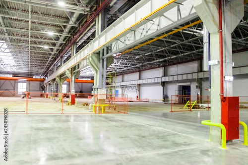 large room with concrete floor at the factory