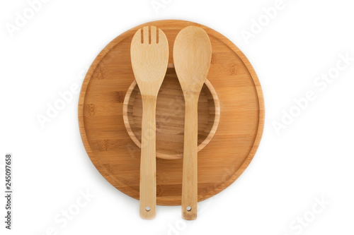 Wooden plate, bowl, spoon and fork isolated on white background bamboo top view