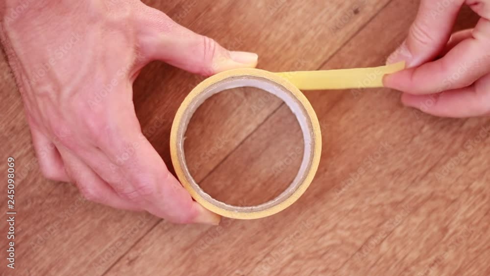 Taking srhred of yellow adhesive tape Taking srhred of yellow adhesive tape