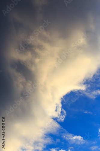 Clouds after rain before sunset as a background