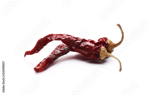 Dry red, spicy peppers, pile isolated on white background