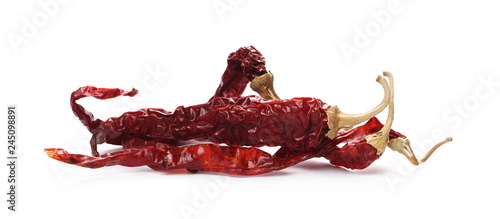 Dry red, spicy peppers, pile isolated on white background