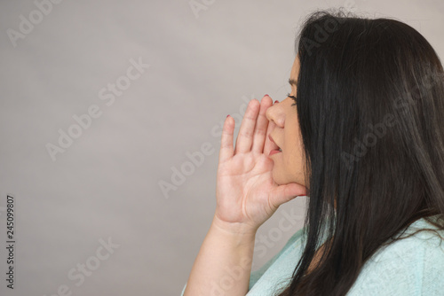 Woman profile whispering gesturing with hand