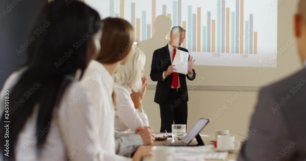 4K Very enthusiastic businessman giving a presentation, explaining charts & graphs 4K Very enthusiastic businessman giving a presentation, explaining charts & graphs