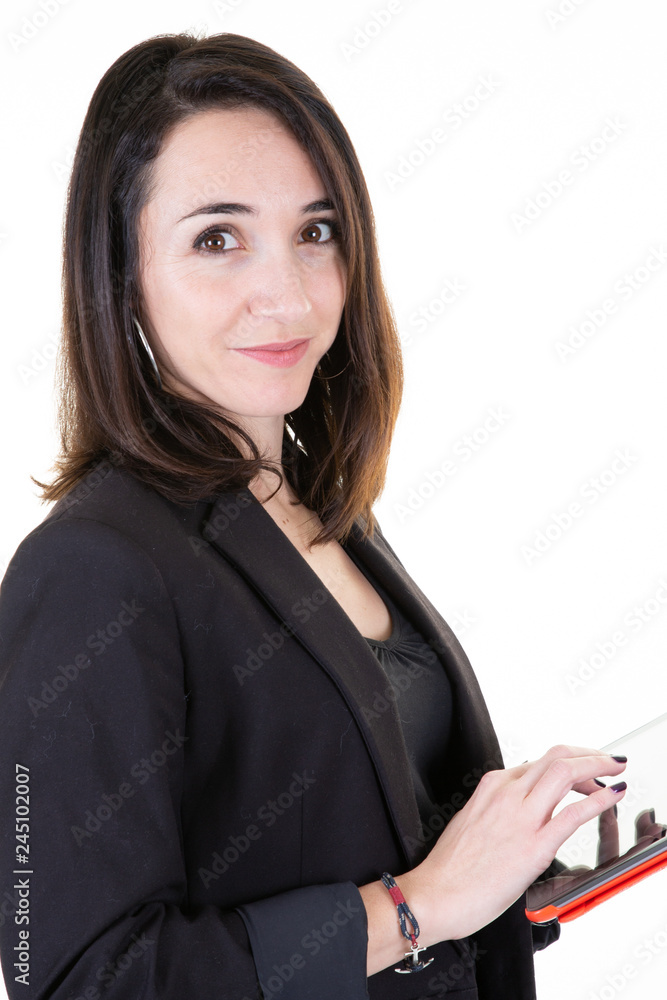 Smiling woman using tablet ebook reader in business suit on white background Smiling woman using tablet ebook reader in business suit on white background