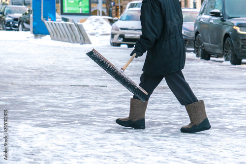 city service cleaning streets from snow with special tools after snowfall b