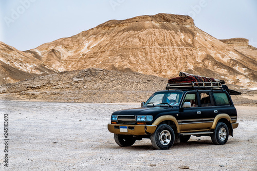 BAHARIYA, EGYPT: Jeep car in Sahara desert, White desert of Egypt (Farafra). photo