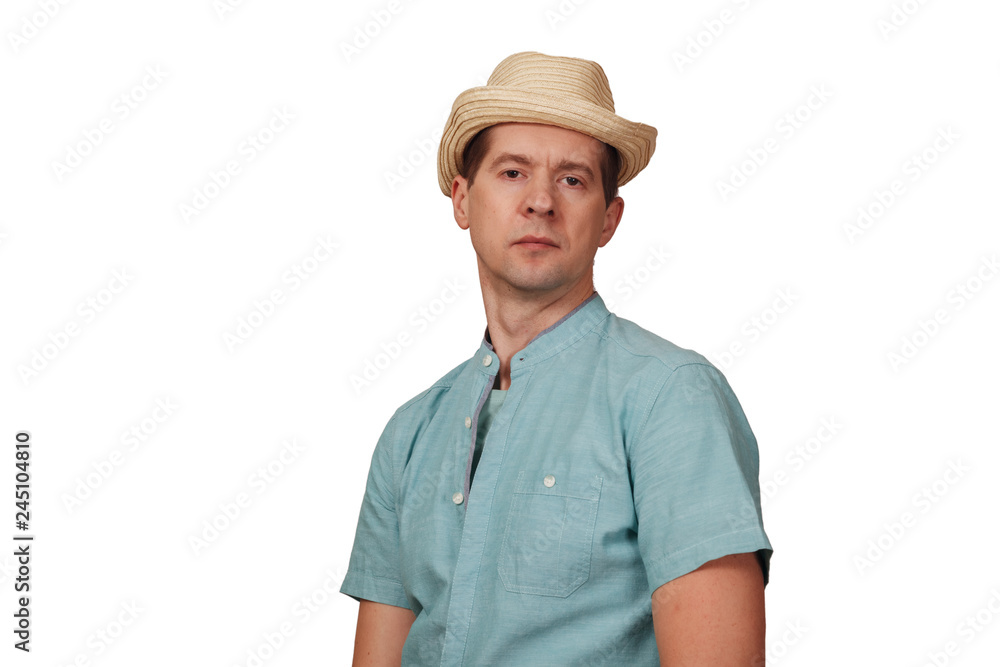 The man's portrait in a shirt and a hat on the head The man's portrait in a shirt and a hat on the head