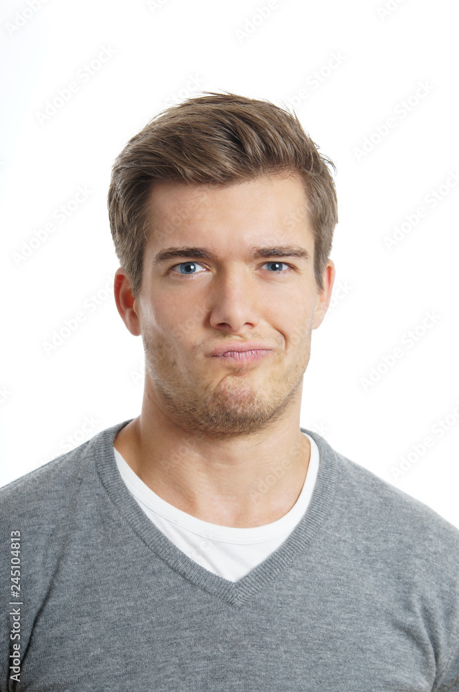 young man is making a funny face. isolated on white background young man is making a funny face. isolated on white background