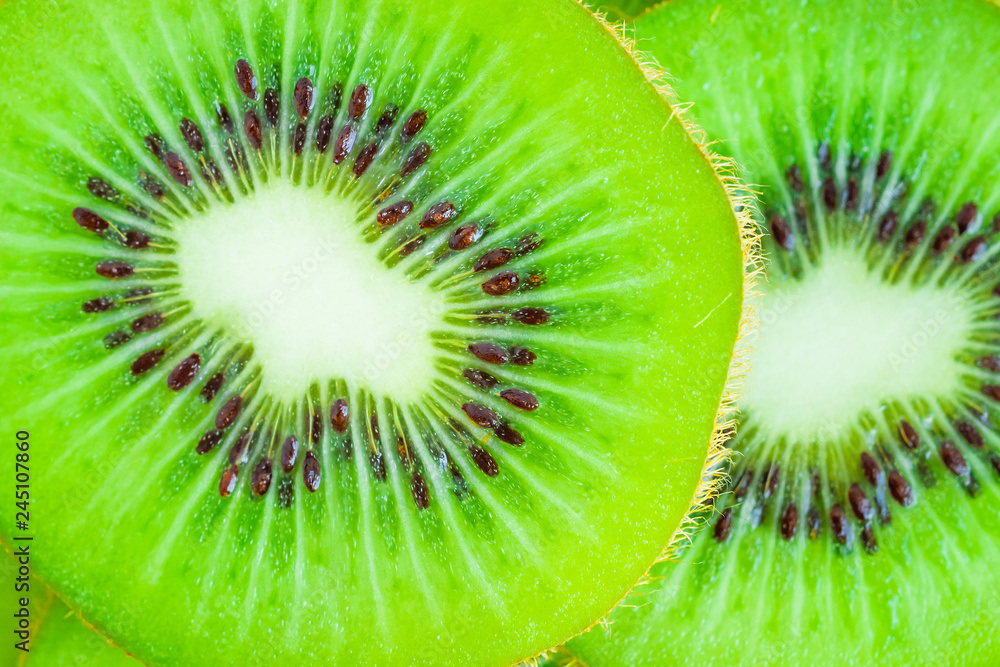 Fresh kiwi fruit slices closeup macro background Fresh kiwi fruit slices closeup macro background