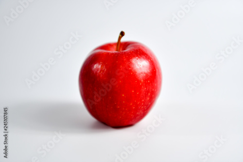 Red ripe apple on white background