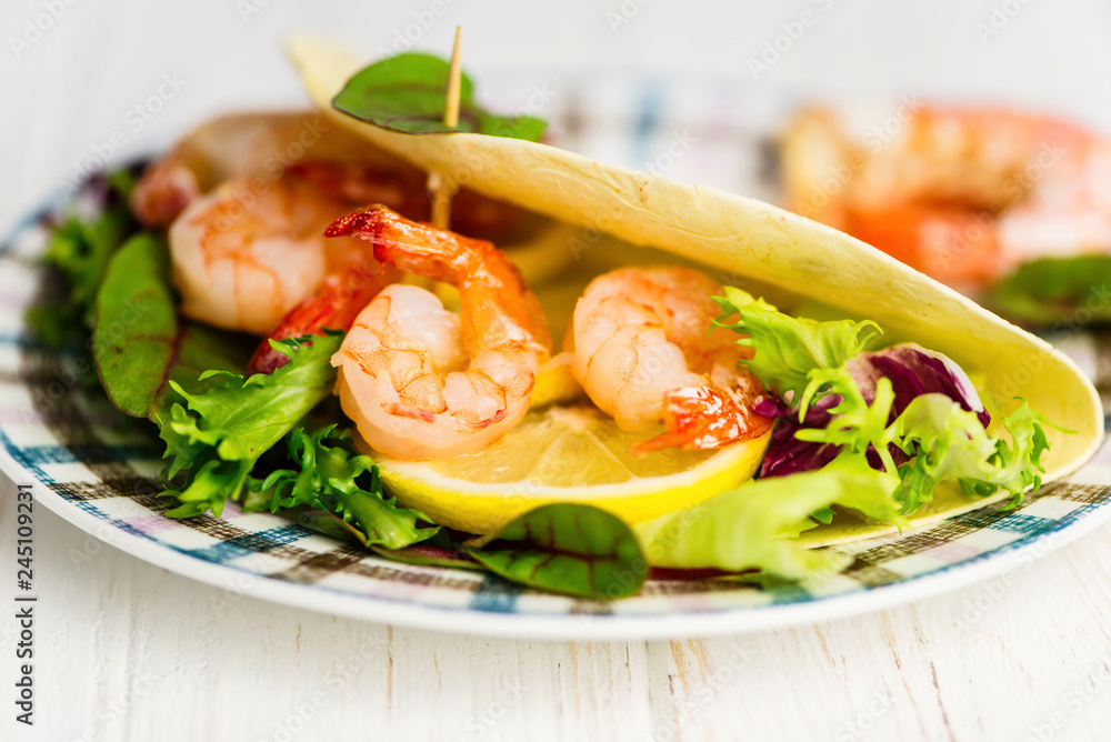 Mexican tortilla stuffed shrimps with lemon and salad Mexican tortilla stuffed shrimps with lemon and salad