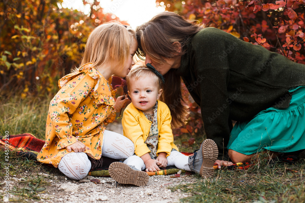Beautiful young mother and her little daughter walking in summer park. Woman and cute kid girl spending time together. Happy family , sunny day Beautiful young mother and her little daughter walking in summer park. Woman and cute kid girl spending time together. Happy family , sunny day