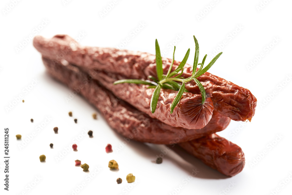Sausage with herbs and spices on a white background - obrazy, fototapety, plakaty 
