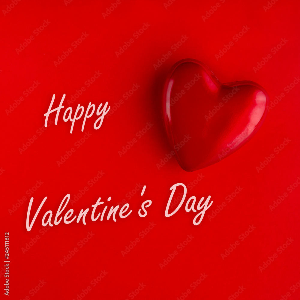 Valentine's Day. Photo of a decorative heart on a background of red and congratulatory inscription.