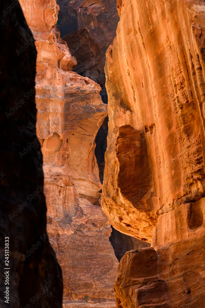 Amazing view of a beautiful red canyon in Petra. Petra is a Unesco World heritage site, historical and archaeological city in southern Jordan.