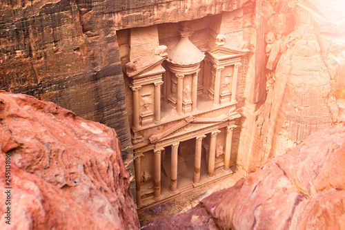 Spectacular view from above of Al Khazneh (The Treasury) in Petra during a sunny day. Petra is a historical and archaeological city in southern Jordan.
