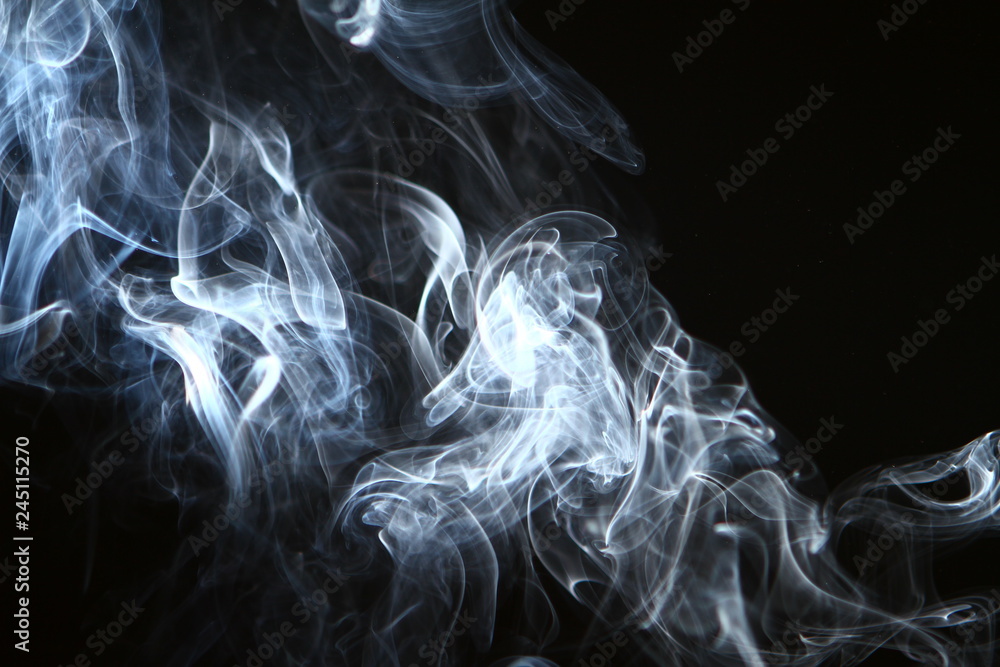 Fototapeta premium lovely abstract glowing bright smoke against black background.