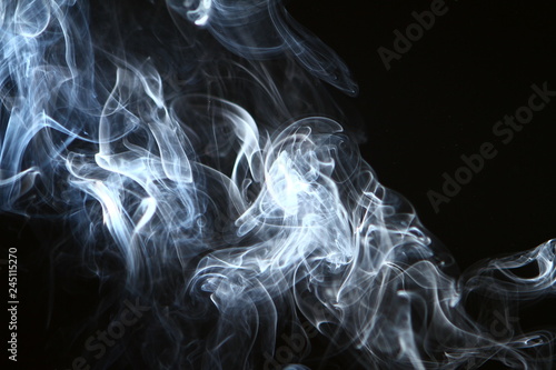 lovely abstract glowing bright smoke against black background.
