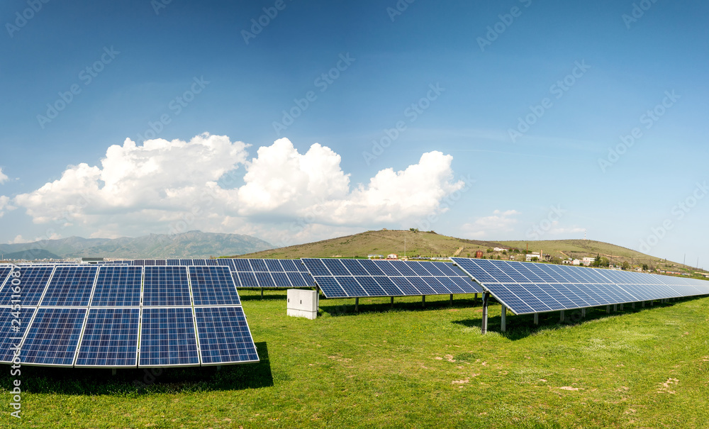 Panoramic view of solar panels, photovoltaics, alternative electricity source - concept of sustainable resources