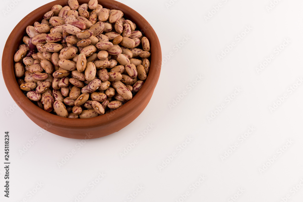 A plate of beans on white background A plate of beans on white background
