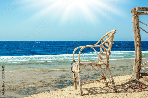 Fototapeta Naklejka Na Ścianę i Meble -  Stylishly beautiful chair on the sea nature landscape background