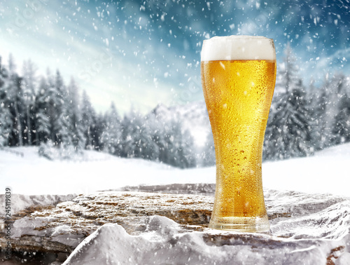 Winter beer on stone and snow decoration 