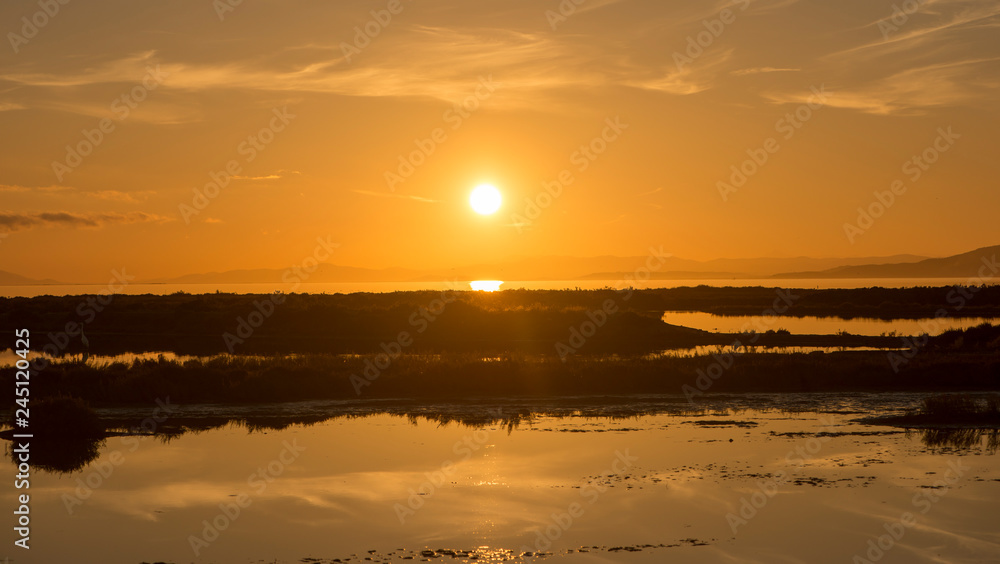 Panoramic of a sunset in the ebro delta by the sea