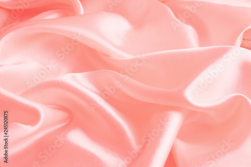 Smooth elegant pink silk or satin texture can use as abstract background, fabric