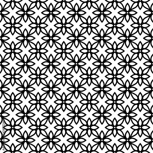 Woodblock printed seamless ethnic all over floral pattern. Traditional oriental ornament of India Kashmir, geometric flowers motif, black on white background. Textile design.