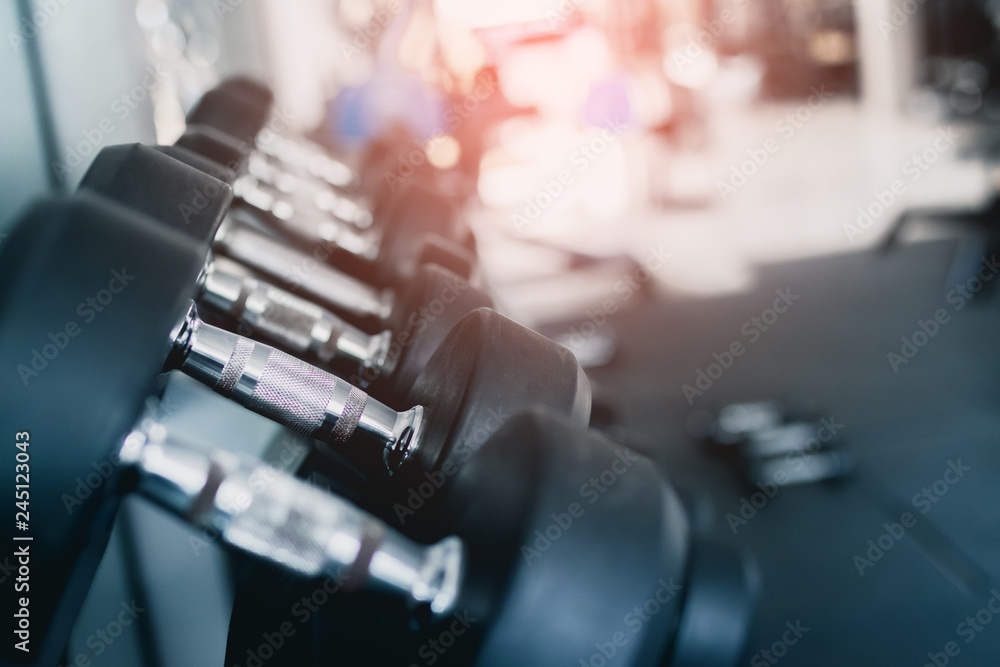 Close up of black dumbbell set at gym. exercise concept. Close up of black dumbbell set at gym. exercise concept.