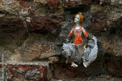 Fototapeta Naklejka Na Ścianę i Meble -  Doll in a wall closeup